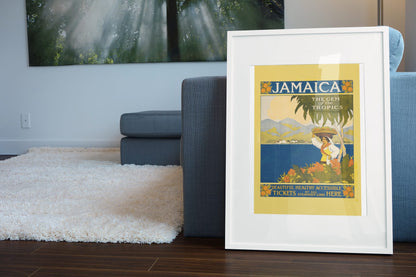 Jamaica Gem of the Tropics poster leaning beside a blue sofa