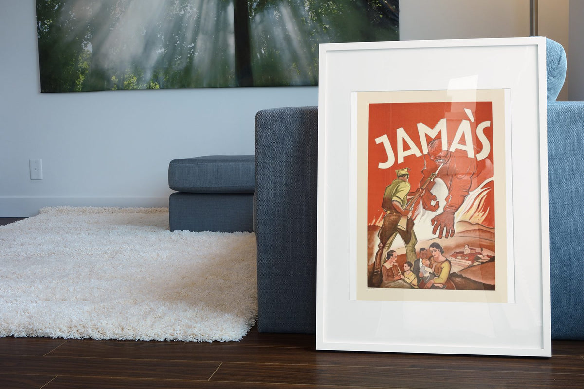 Jamas Never poster leaning beside a blue sofa