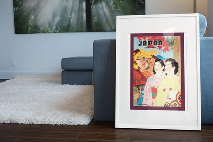 Japan Autumn poster leaning beside a blue sofa