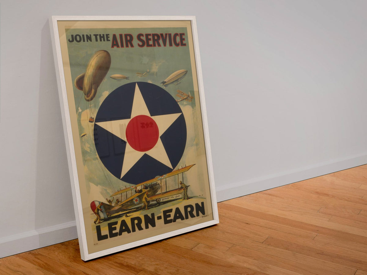 Join the Air Service Learn Earn poster in a white frame leaning against a wall