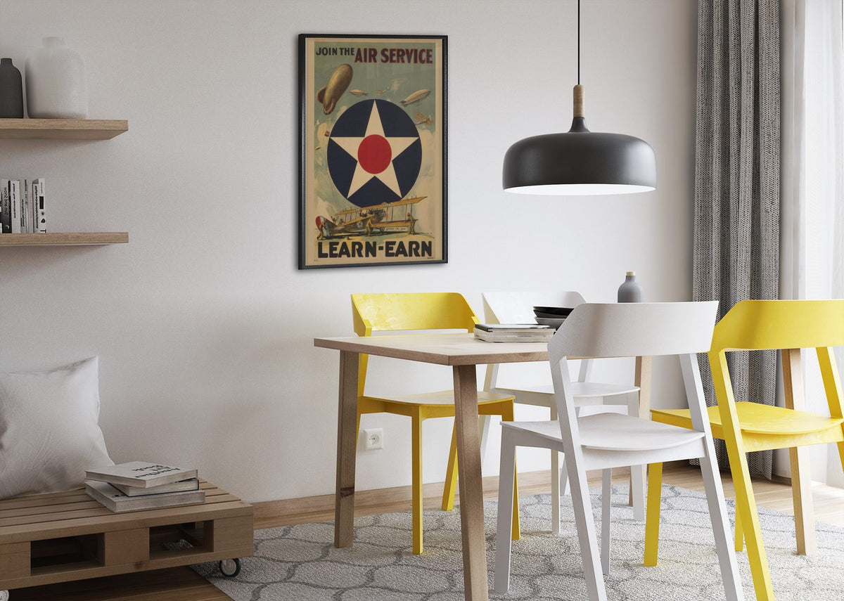 Join the Air Service Learn Earn poster framed above a dining table