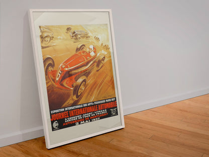 Journée Internationale Automobile Paris 1937 poster in a white frame leaning against a wall