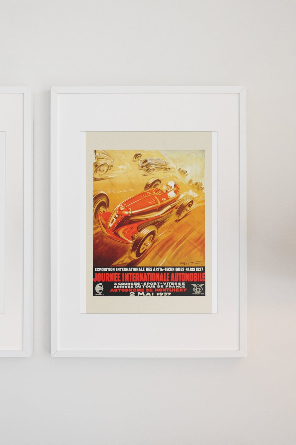 Journée Internationale Automobile Paris 1937 poster in a white frame on a light wall