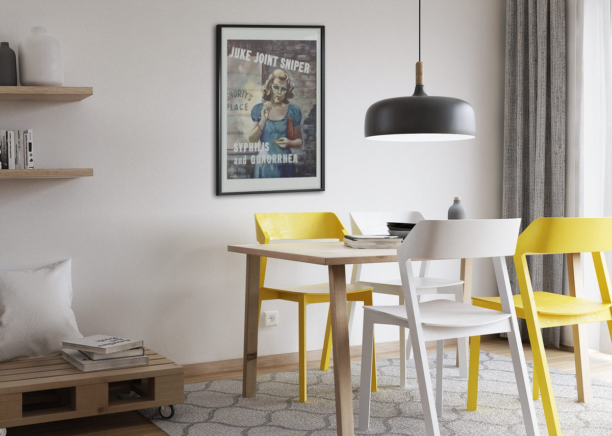 Juke Joint Sniper poster framed above a dining table