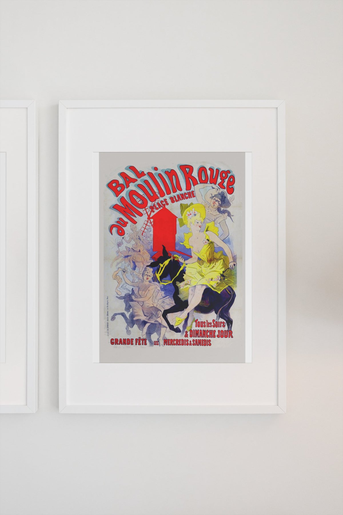Jules Chéret Bal au Moulin Rouge poster in a white frame on a light wall