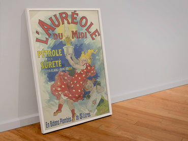 Jules Chéret L'Auréole du Midi poster in a white frame leaning against a wall