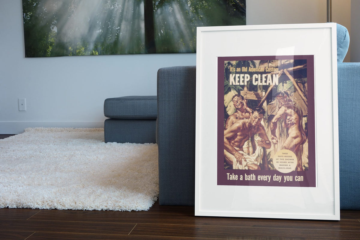 Keep Clean An Old American Custom poster leaning beside a blue sofa