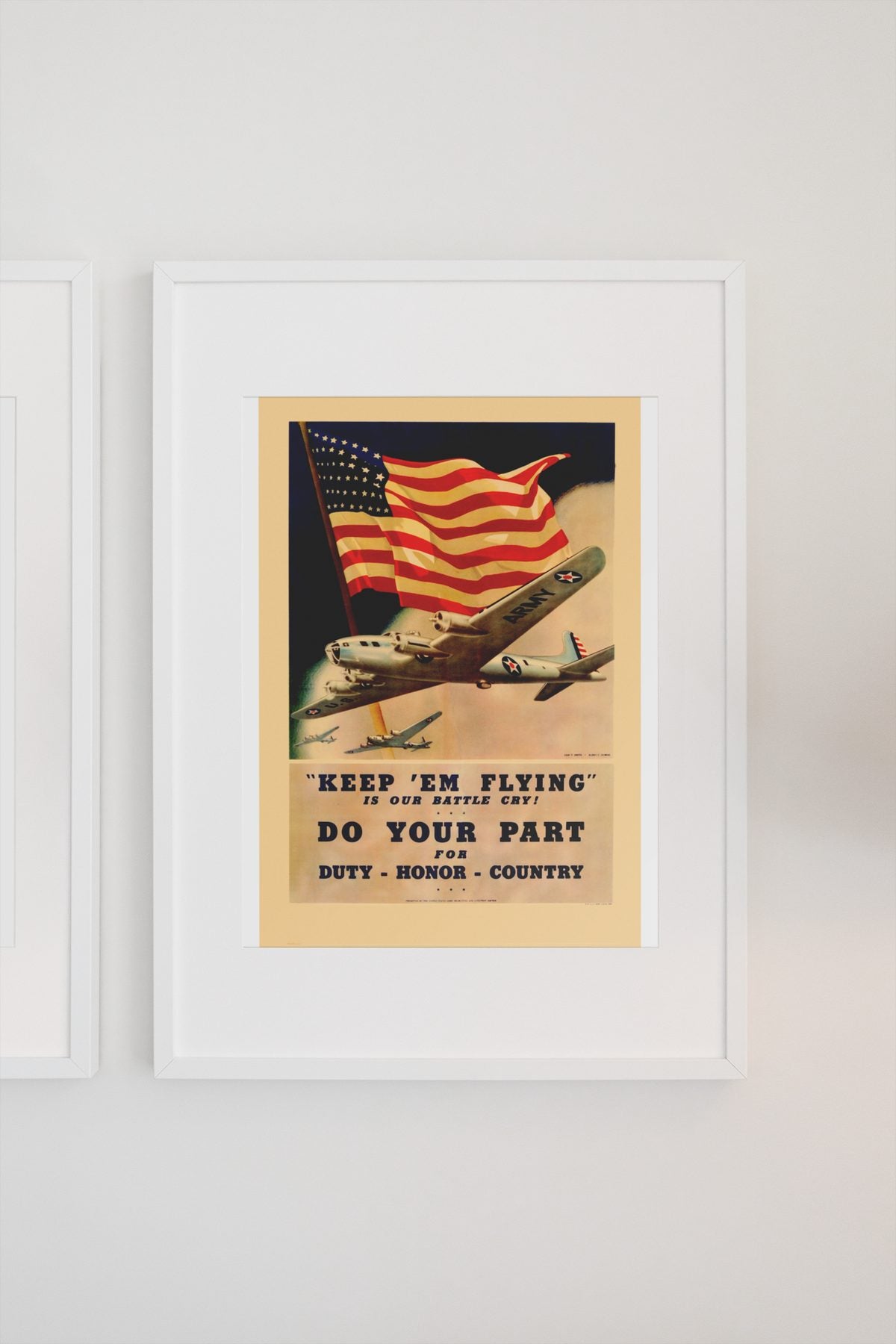 Keep Em Flying poster on a light wall