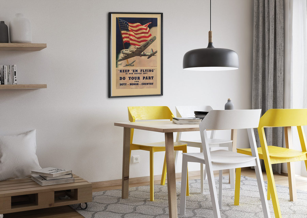 Keep Em Flying poster framed above a dining table