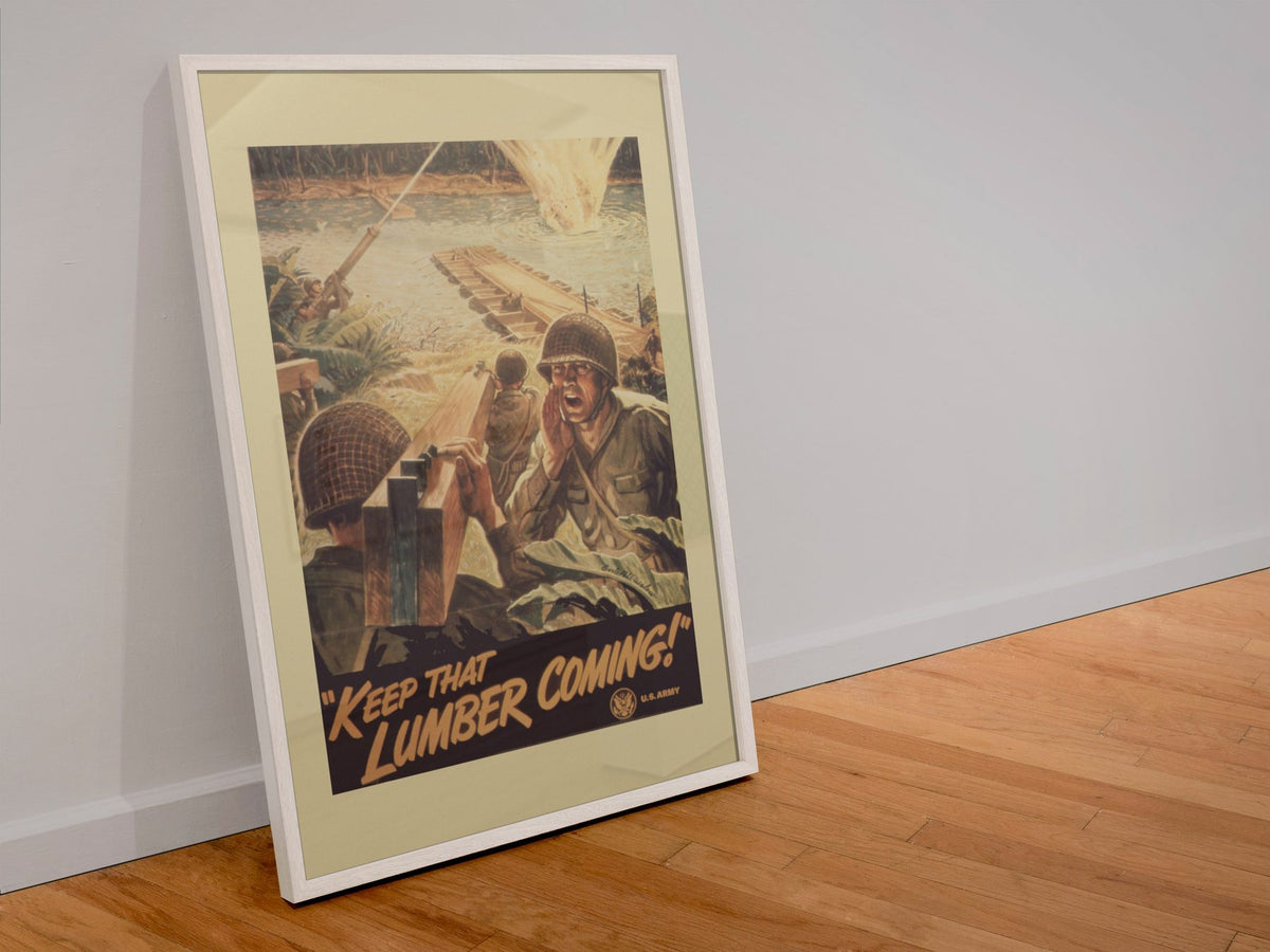 Keep That Lumber Coming poster in a white frame leaning against a wall