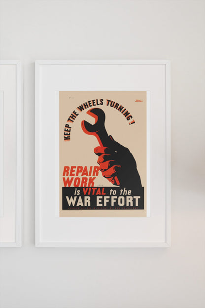 Keep the Wheels Turning Repair Work Is Vital poster on a light wall