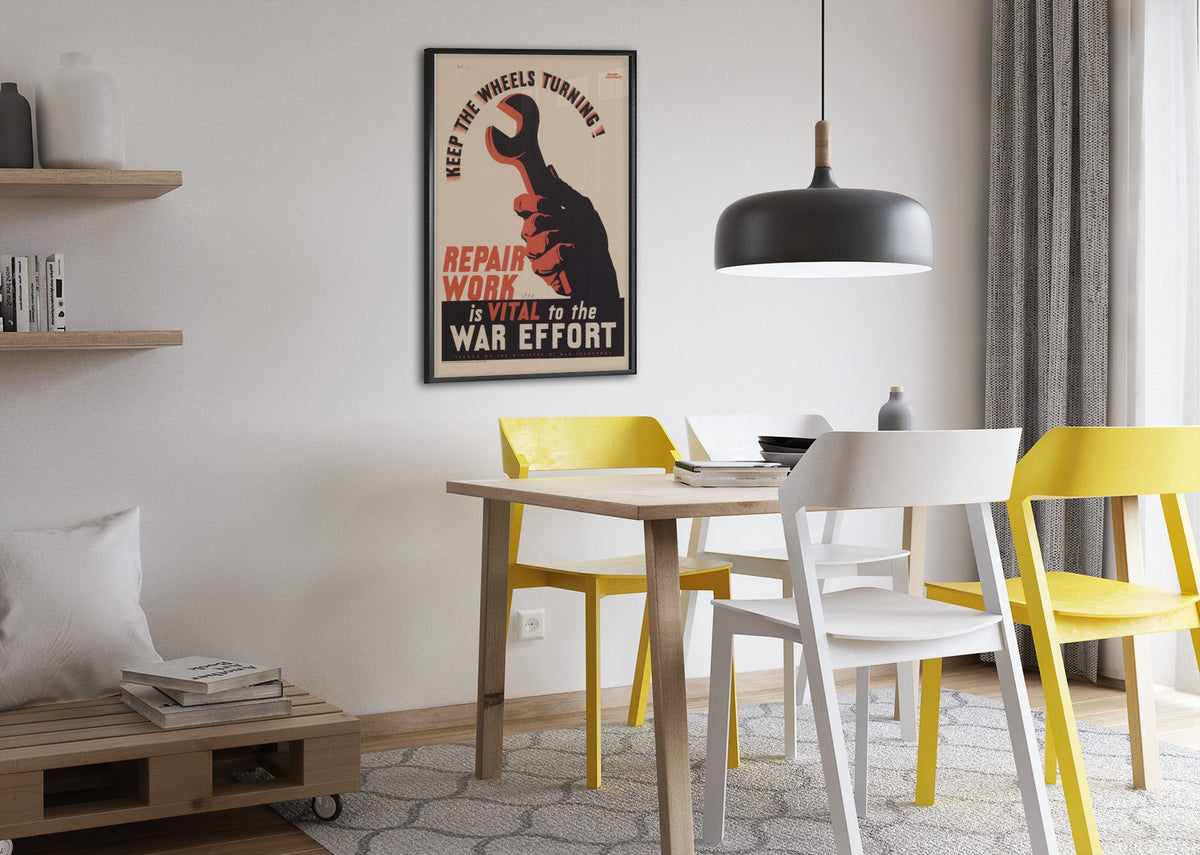 Keep the Wheels Turning Repair Work Is Vital poster framed above a dining table