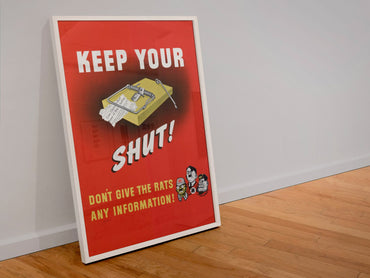 Keep Your Trap Shut poster in a white frame leaning against a wall