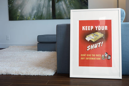 Keep Your Trap Shut poster leaning beside a blue sofa