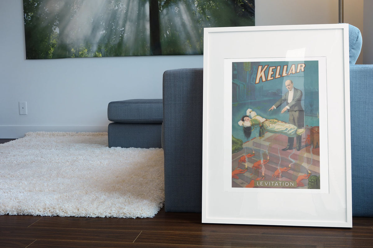 Kellar Levitation poster leaning beside a blue sofa