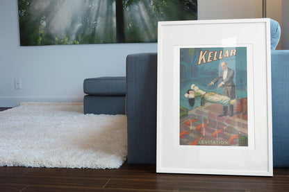 Kellar Levitation poster leaning beside a blue sofa