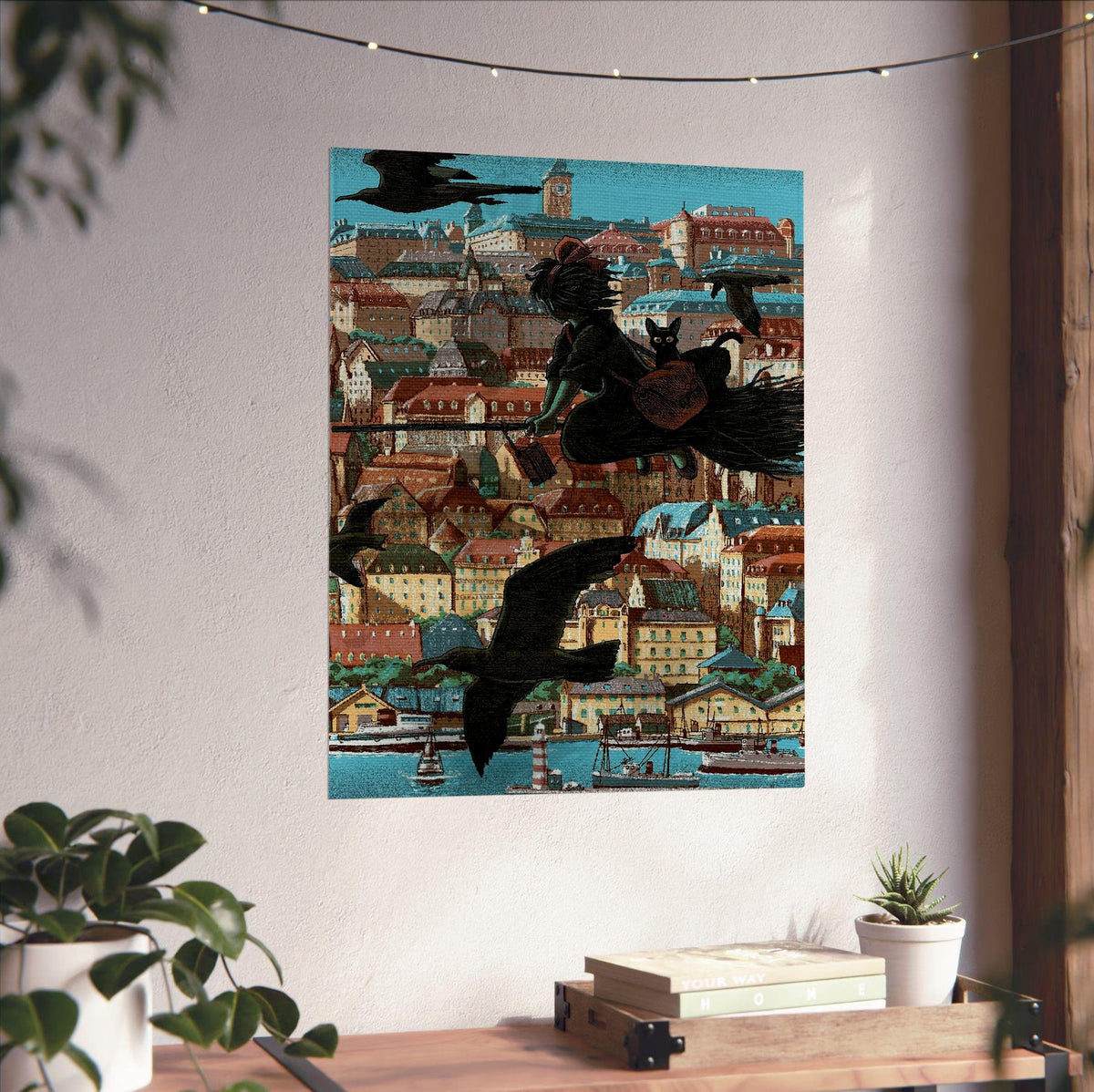 Kiki's Delivery Service Koriko Town Illustrated Art poster unframed on a white wall above a desk