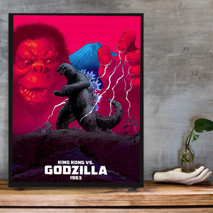 King Kong vs. Godzilla (1963) Movie Red Pop Art poster in a black frame on a wooden shelf against concrete