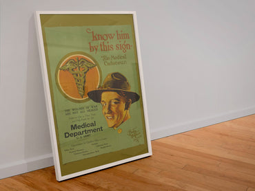 Know Him by This Sign Medical Department poster in a white frame leaning against a wall