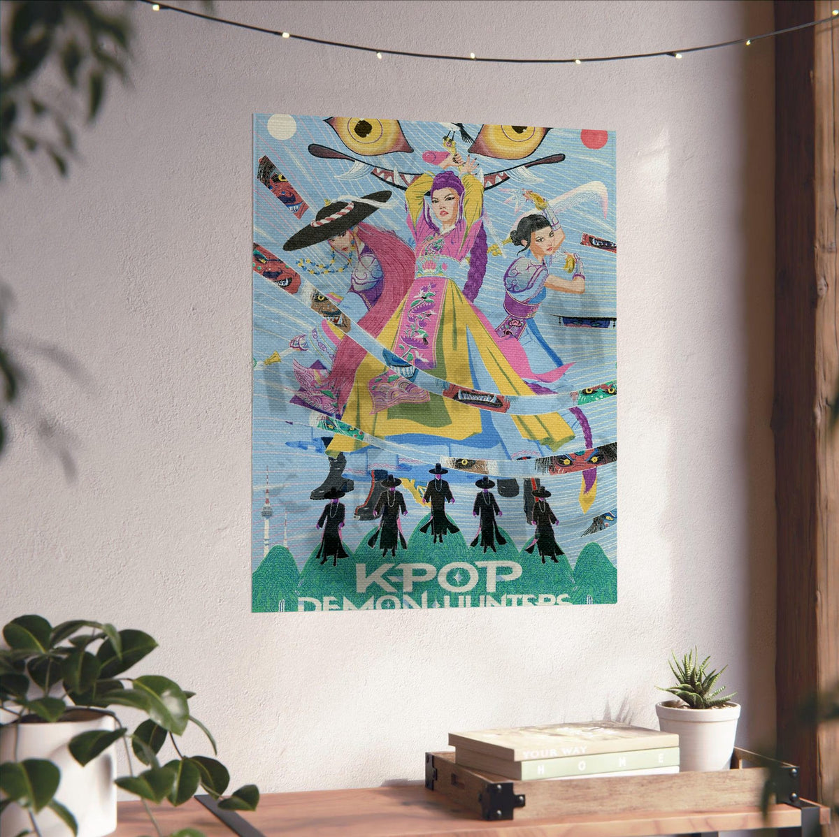 KPop Demon Hunters (2025) Movie Folk Art Illustrated poster unframed on a white wall above a desk