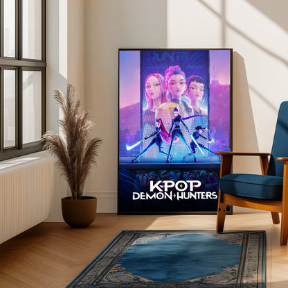 KPop Demon Hunters (2025) Movie Huntrix Key Art poster framed beside a blue armchair in a sunlit room