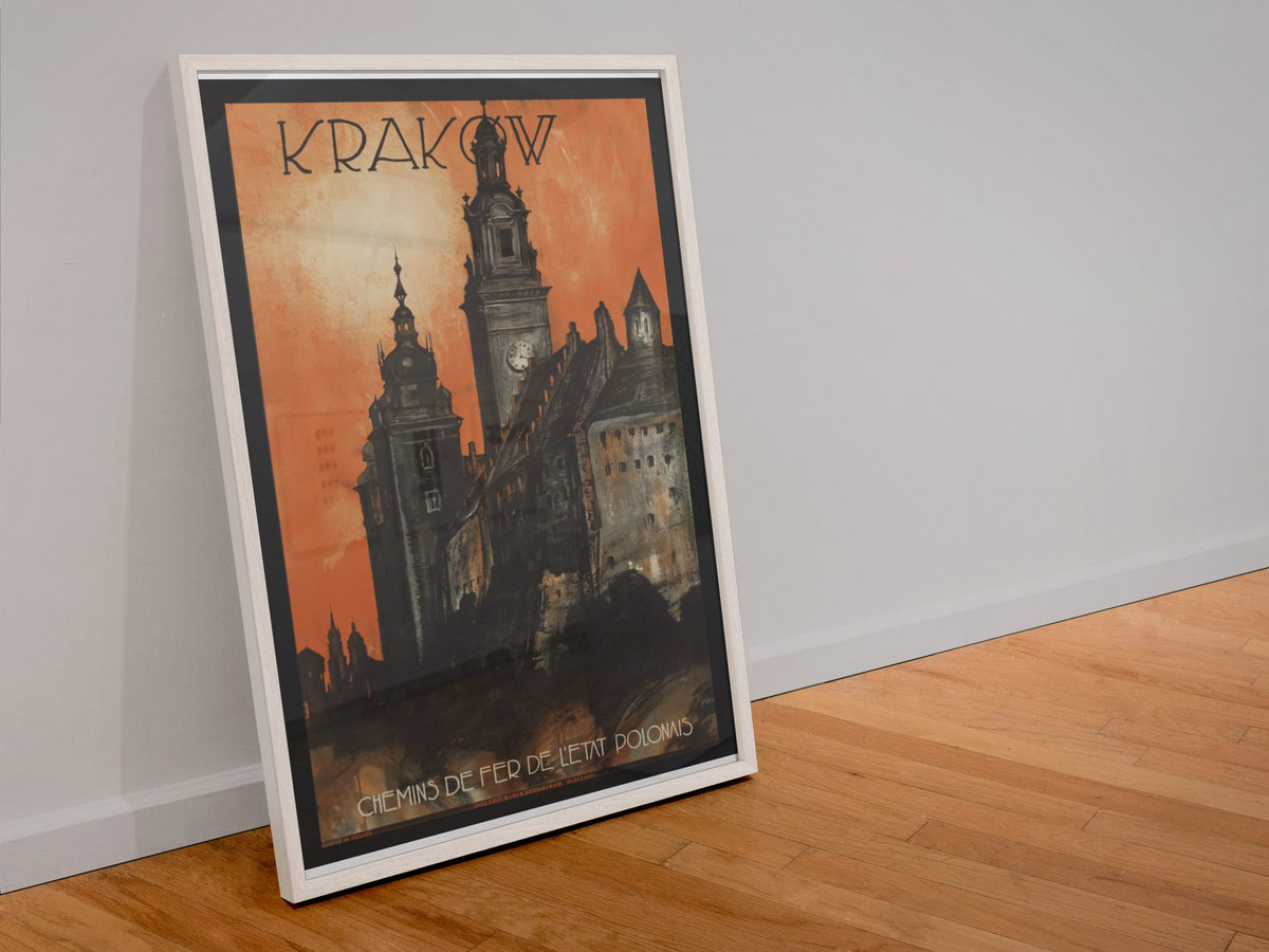Krakow Poland poster in a white frame leaning against a wall