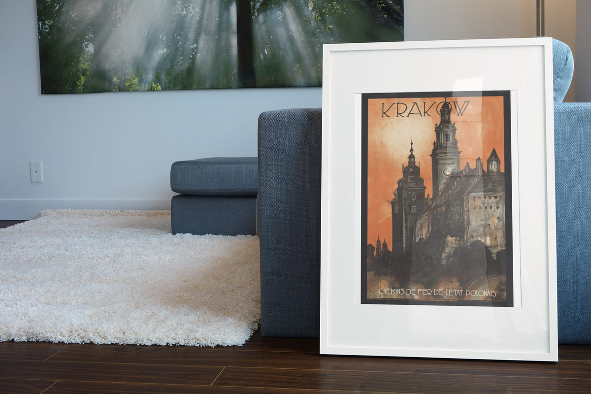 Krakow Poland poster leaning beside a blue sofa