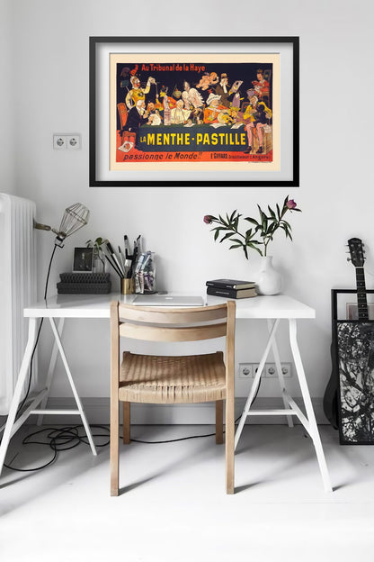 La Menthe-Pastille poster framed above a desk in a bright white room