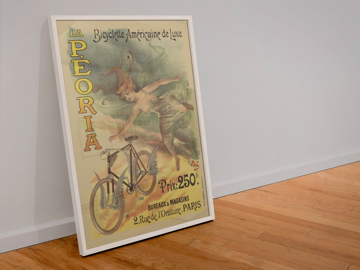 La Peoria Bicyclette poster in a white frame leaning against a wall