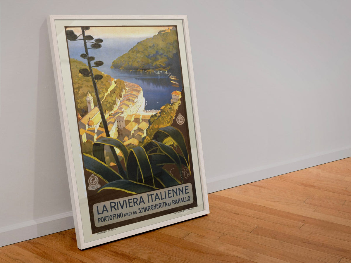 La Riviera Italienne Portofino poster in a white frame leaning against a wall