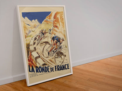 La Ronde de France poster in a white frame leaning against a wall