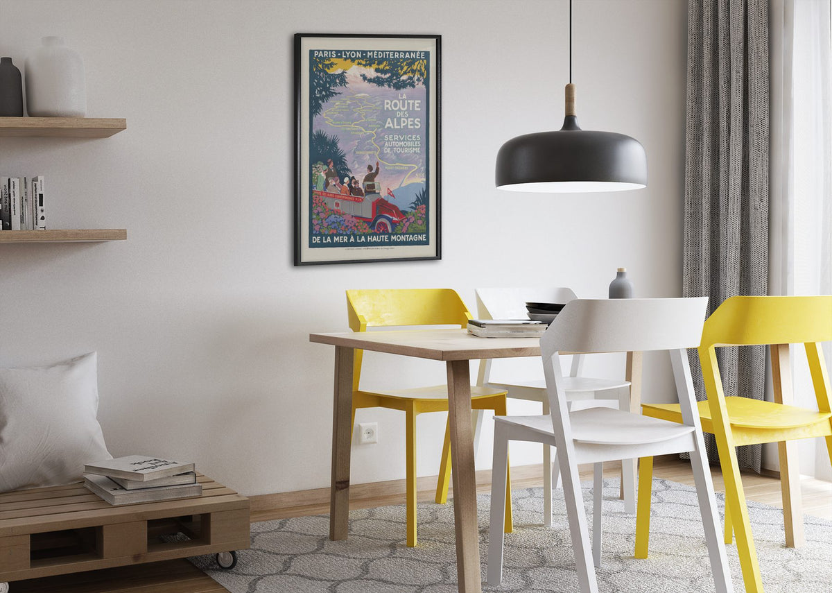 La Route des Alpes poster framed above a dining table