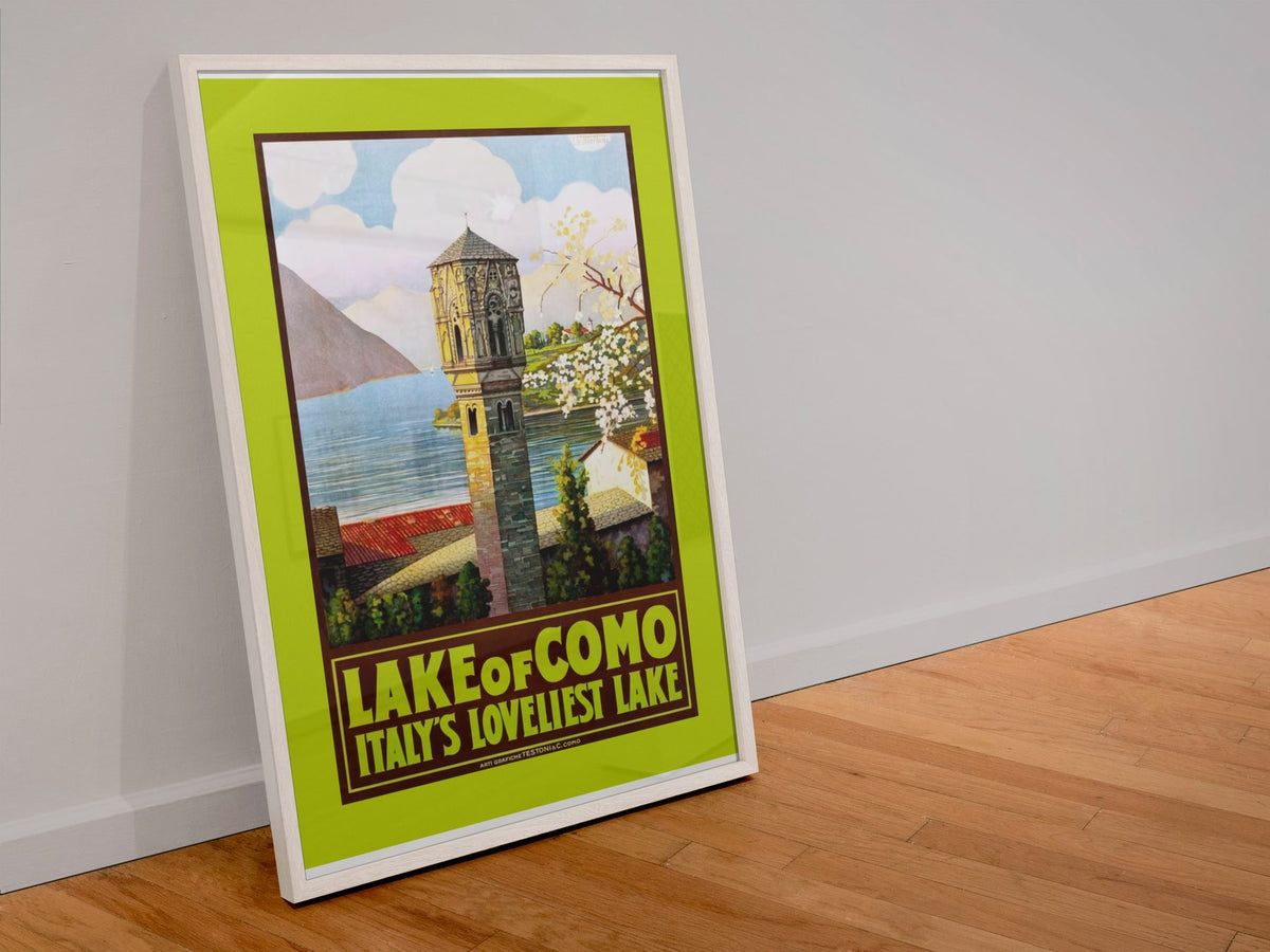 Lake Como Italys Loveliest Lake poster in a white frame leaning against a wall