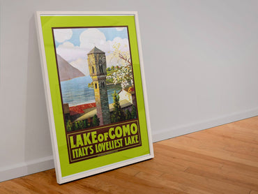 Lake Como Italys Loveliest Lake poster in a white frame leaning against a wall