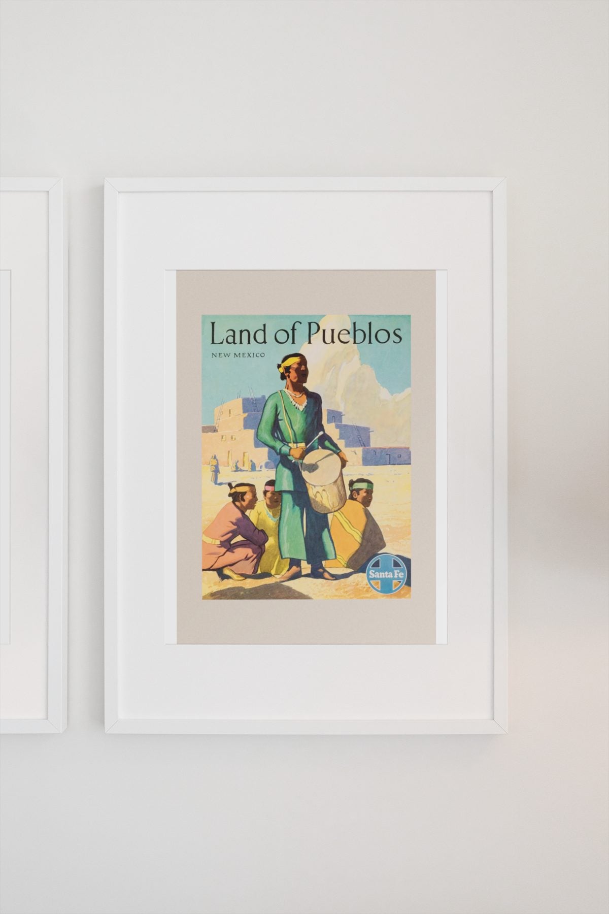 Land of Pueblos Santa Fe poster on a light wall
