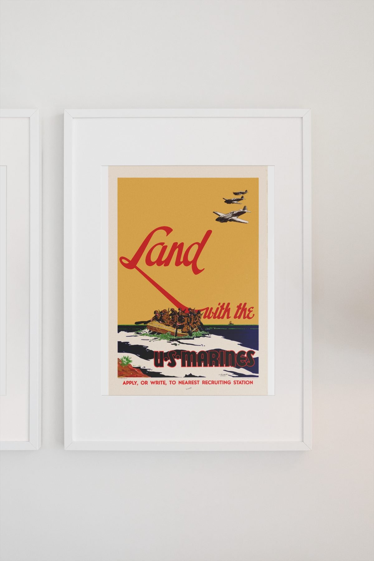 Land with the U.S. Marines poster on a light wall