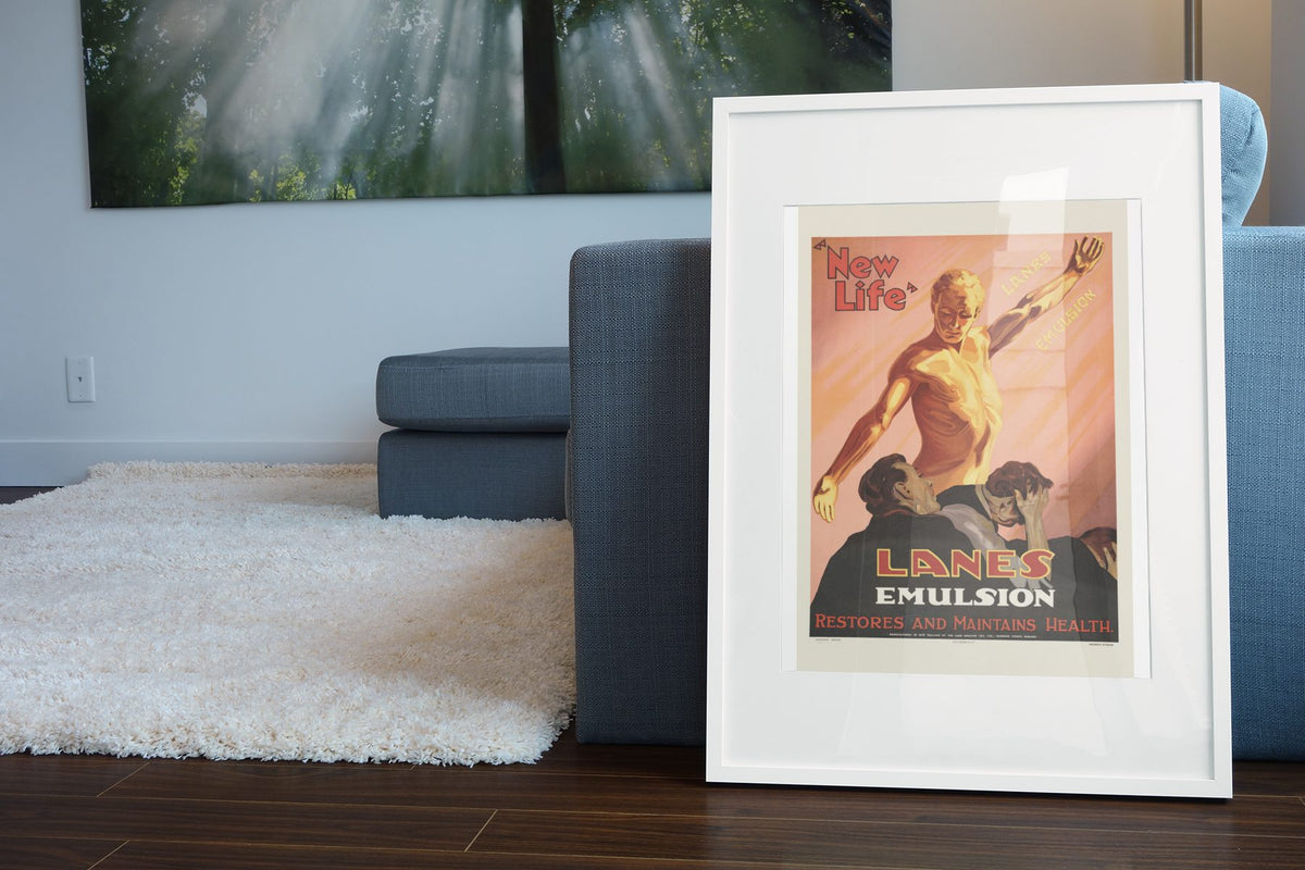 Lanes Emulsion New Life poster leaning beside a blue sofa