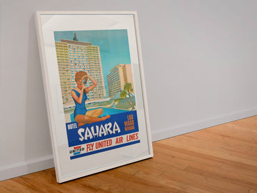 Las Vegas Sahara Hotel poster in a white frame leaning against a wall