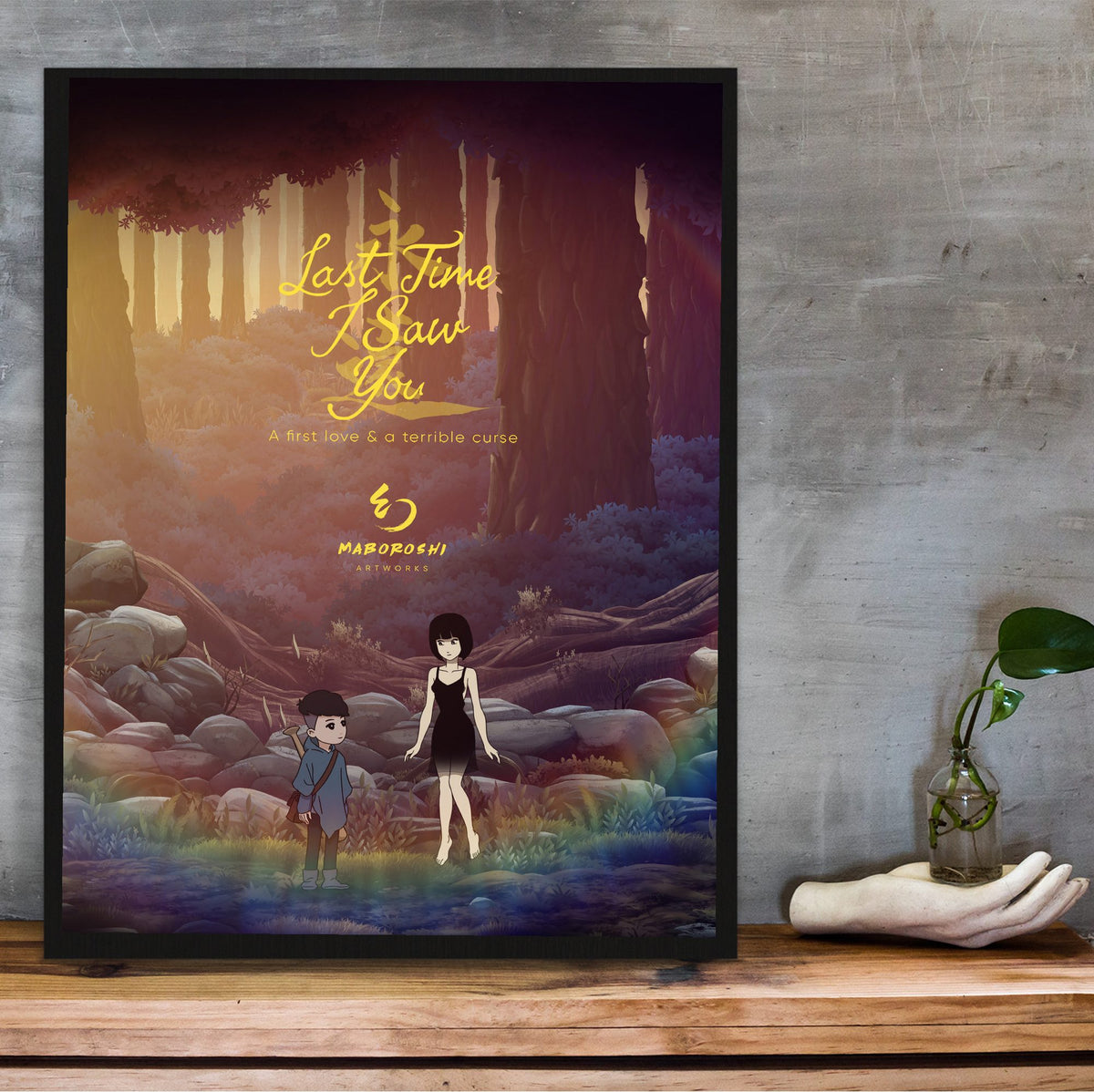 Last Time I Saw You Forest Art poster in a black frame on a wooden shelf against concrete