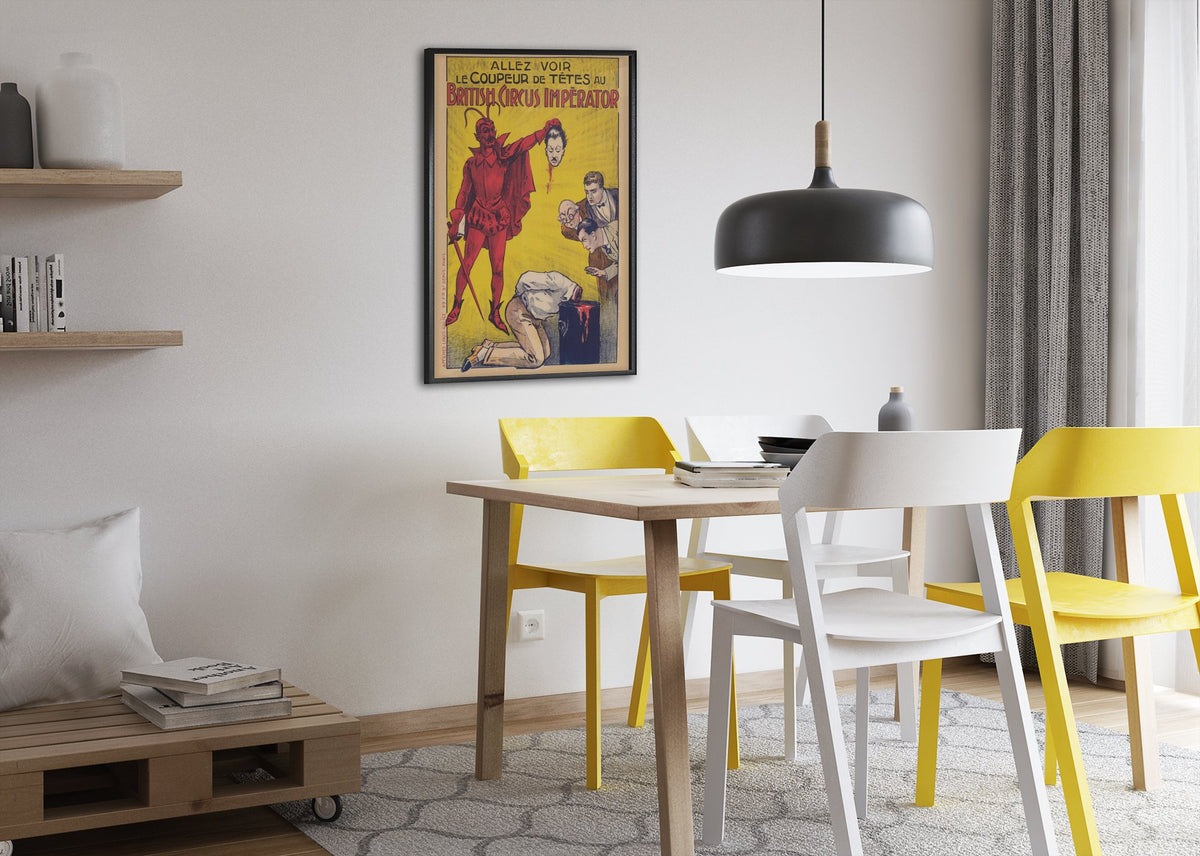 Le Coupeur de Tetes devil headsman poster framed above a dining table