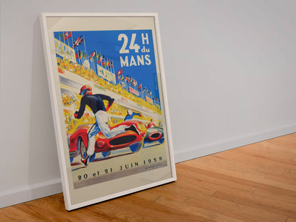 24 Heures du Mans 1959 poster in a white frame leaning against a wall