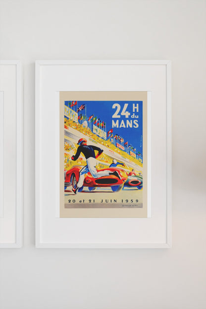 24 Heures du Mans 1959 poster in a white frame on a light wall
