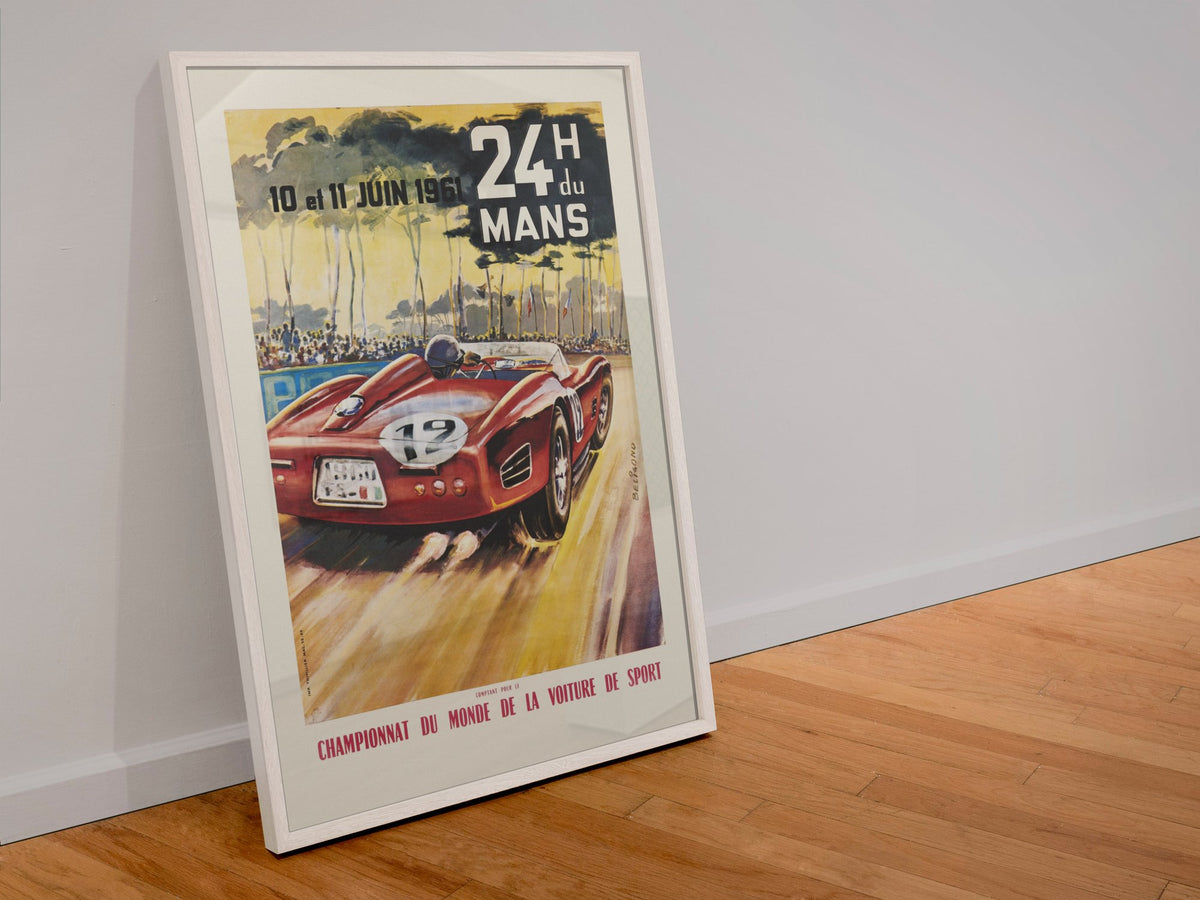 24 Heures du Mans 1961 poster in a white frame leaning against a wall