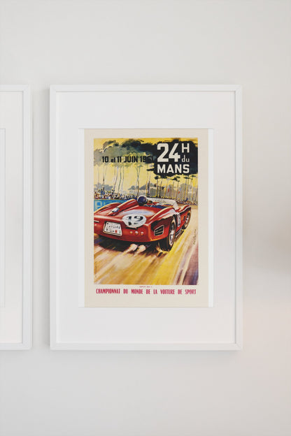 24 Heures du Mans 1961 poster in a white frame on a light wall