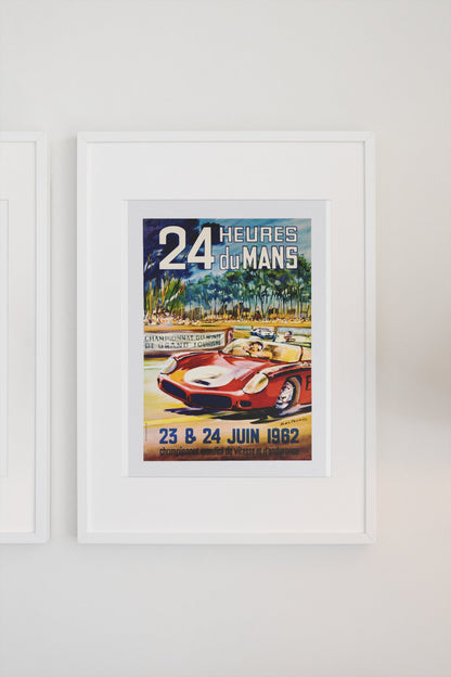 24 Heures du Mans 1962 poster in a white frame on a light wall