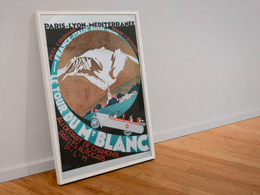 Le Tour du Mont Blanc poster in a white frame leaning against a wall
