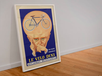 Le Velo Dixi poster in a white frame leaning against a wall
