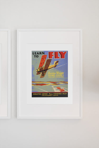Learn to Fly Curtiss Wright poster on a light wall
