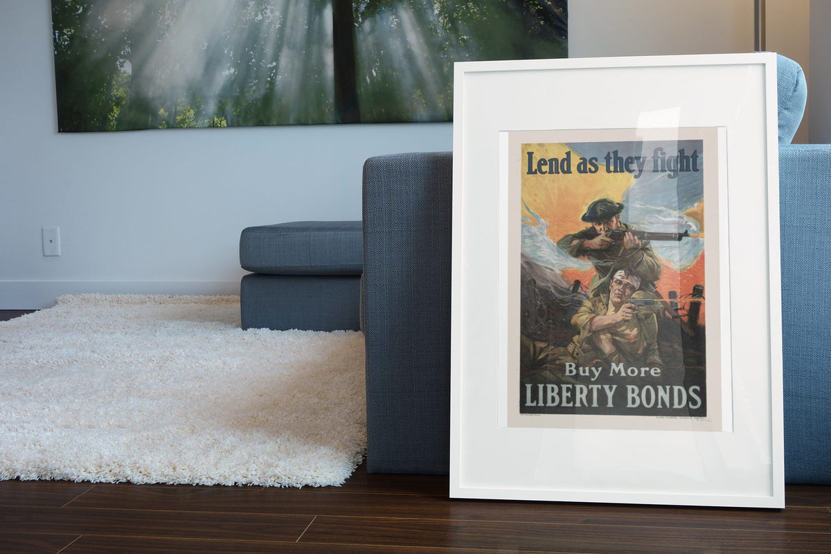Lend as They Fight Liberty Bonds poster leaning beside a blue sofa