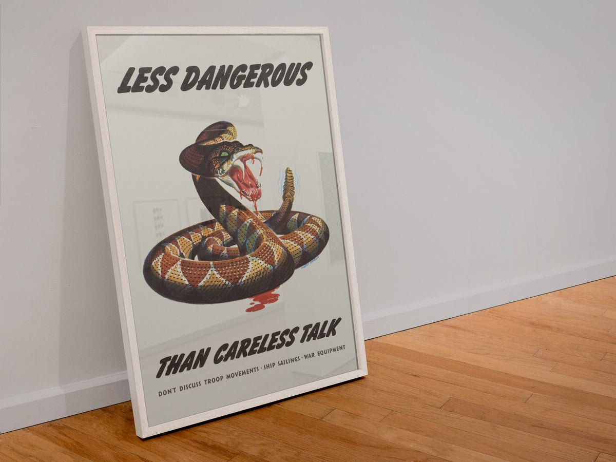 Less Dangerous Than Careless Talk Rattlesnake poster in a white frame leaning against a wall
